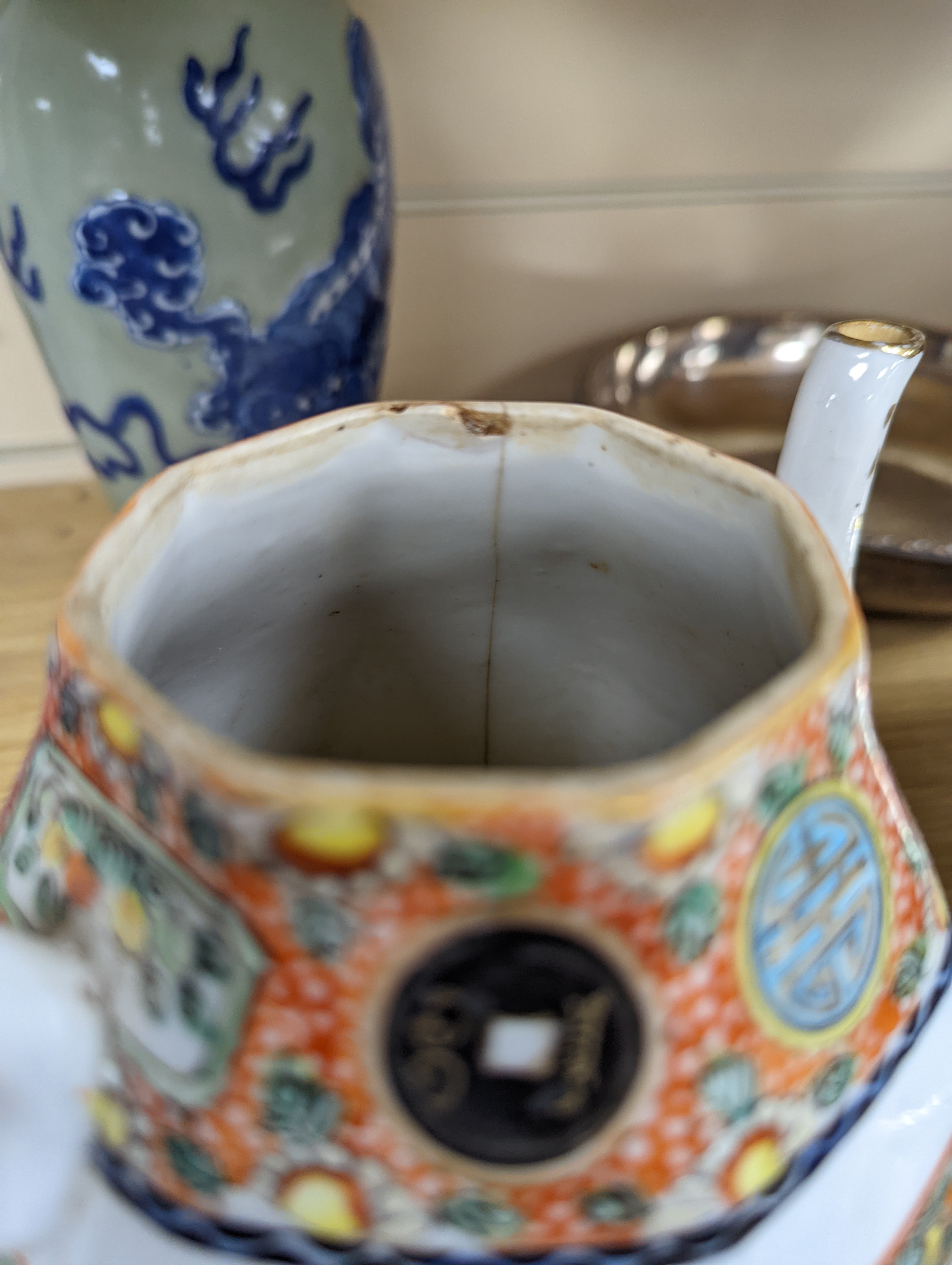 A Chinese celadon glazed vase, 24cm and a Chinese famille rose teapot and matching cream jug, a.f.